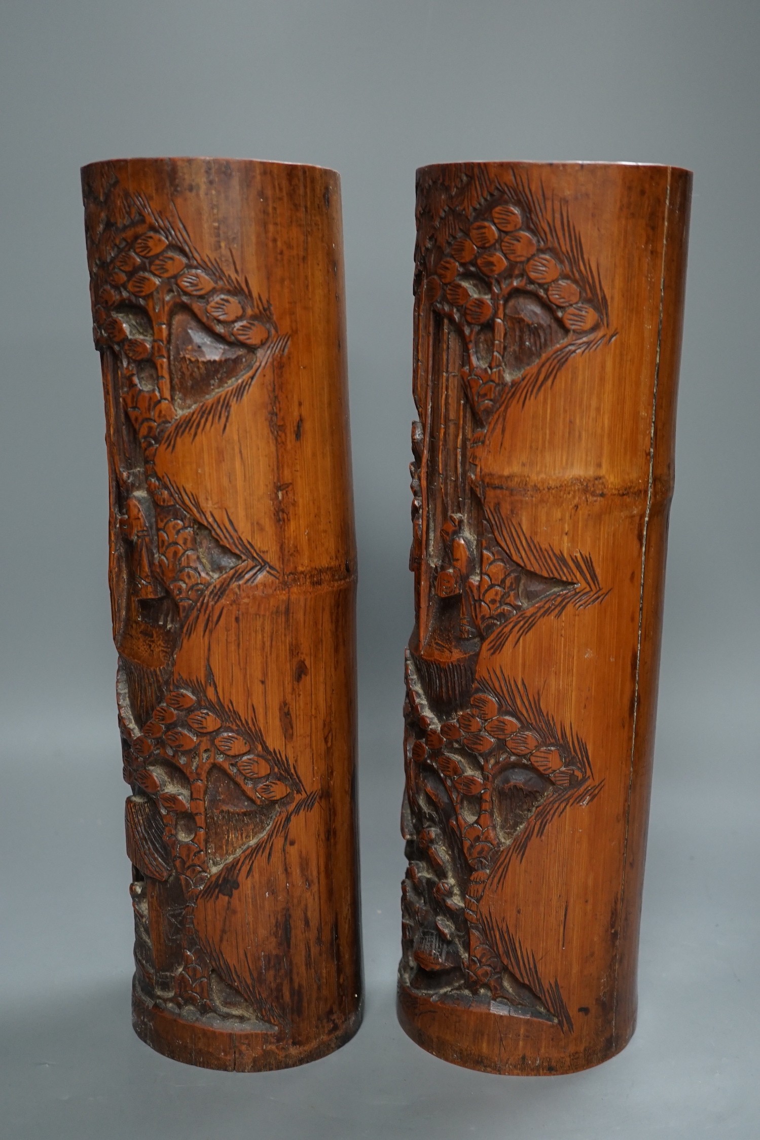 A pair of Chinese carved bamboo brush pots, 35 cms high